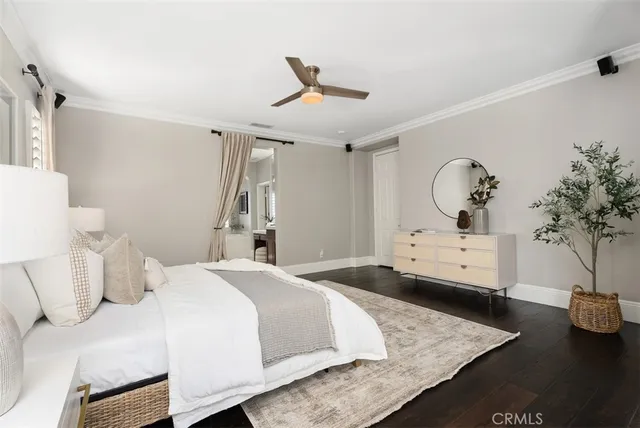 a bedroom with furniture and windows