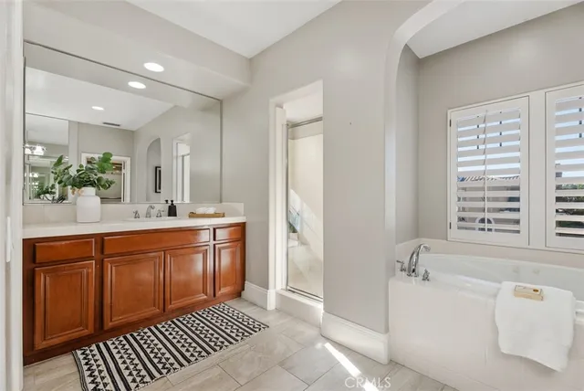 a bathroom with a toilet a sink and glass door