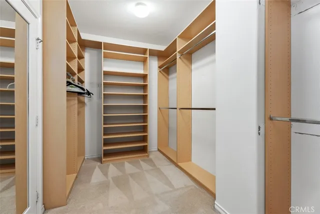 a bed room with a bed and a chandelier