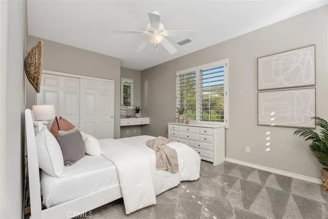 a front view of a house with a yard and fountain