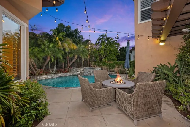 a view of a patio with couches and potted plants