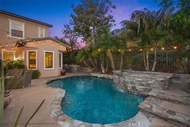 a view of backyard with sitting area