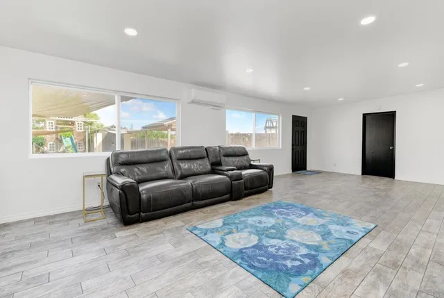a living room with a couch and a rug