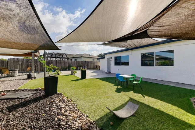a view of swimming pool with a patio