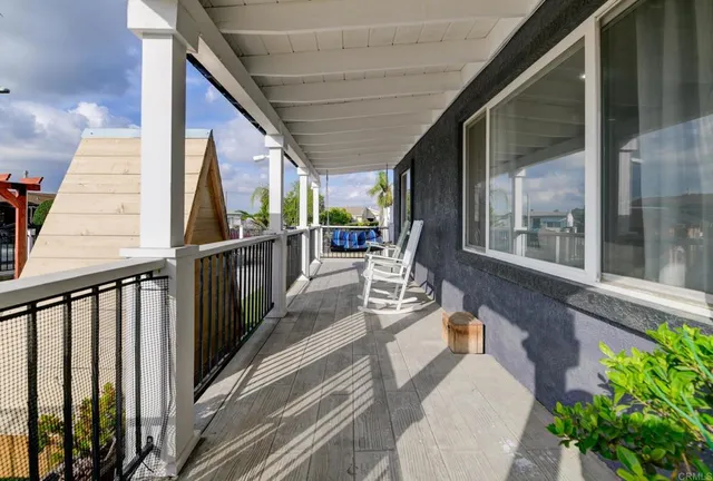 a view of a balcony with chairs