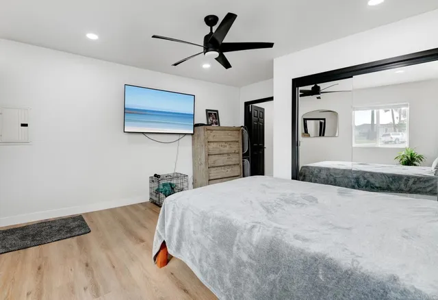 a bedroom with a bed and a dresser