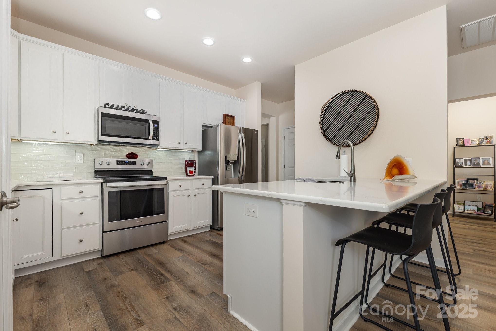 881 Platinum Drive Fort Mill, SC 29708 - Photo 13 of 35 a kitchen with a sink a stove and refrigerator