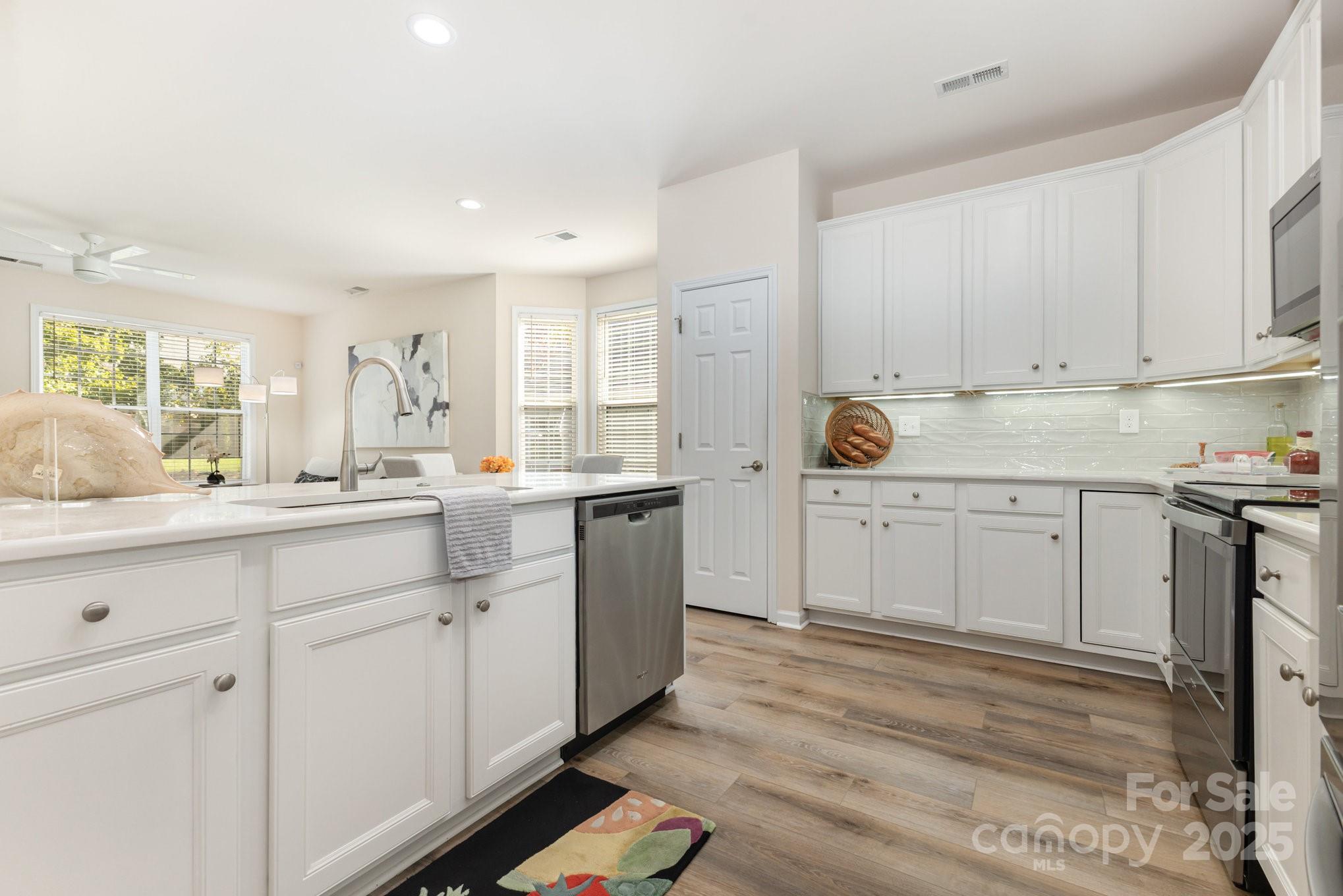 881 Platinum Drive Fort Mill, SC 29708 - Photo 14 of 35 a kitchen with white cabinets appliances and a window