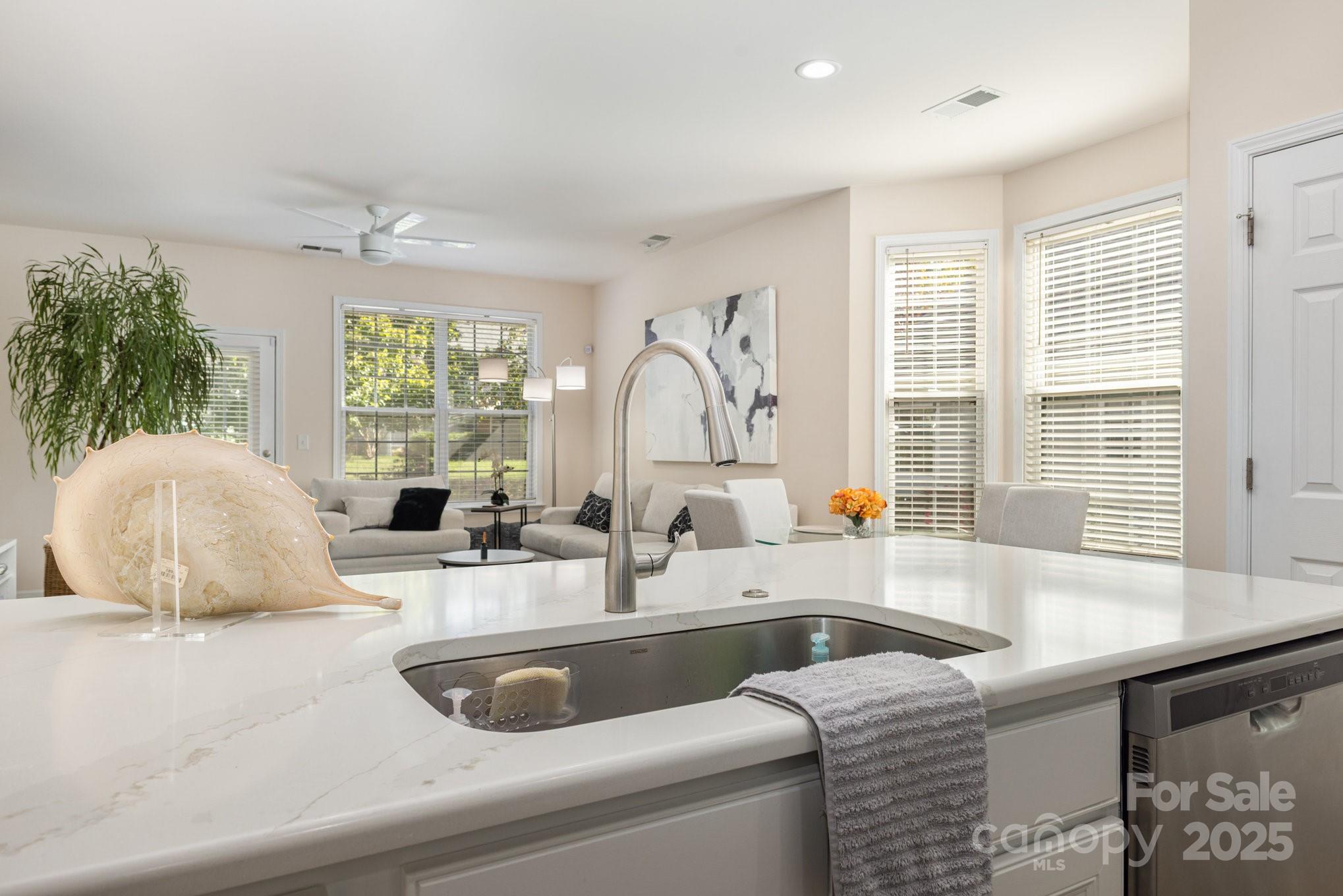 881 Platinum Drive Fort Mill, SC 29708 - Photo 17 of 35 a kitchen with a sink and a large window