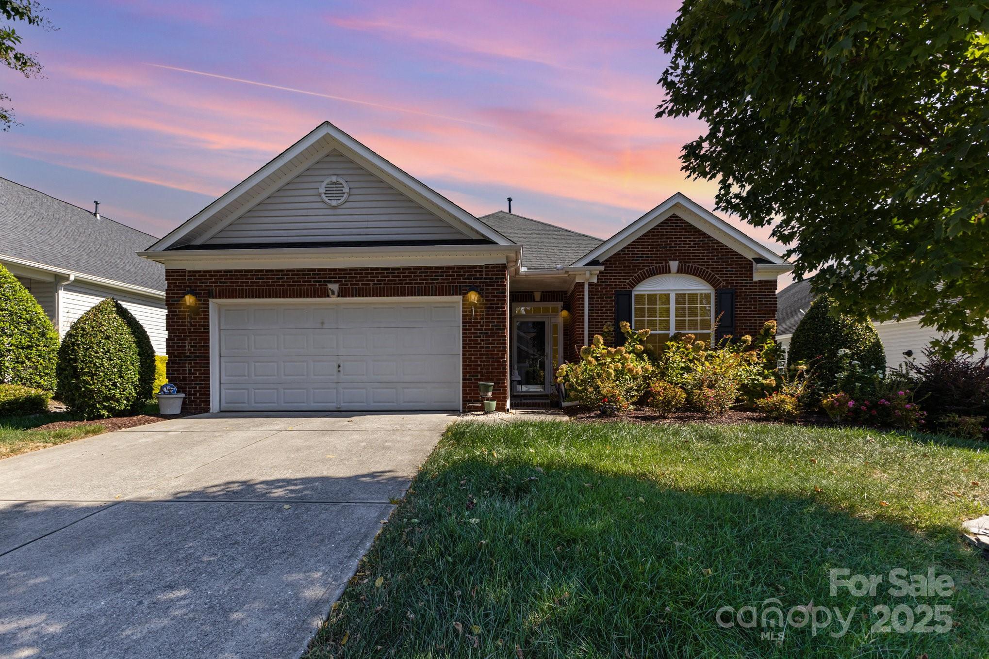 881 Platinum Drive Fort Mill, SC 29708 - Photo 2 of 35 a front view of a house with a yard and garage