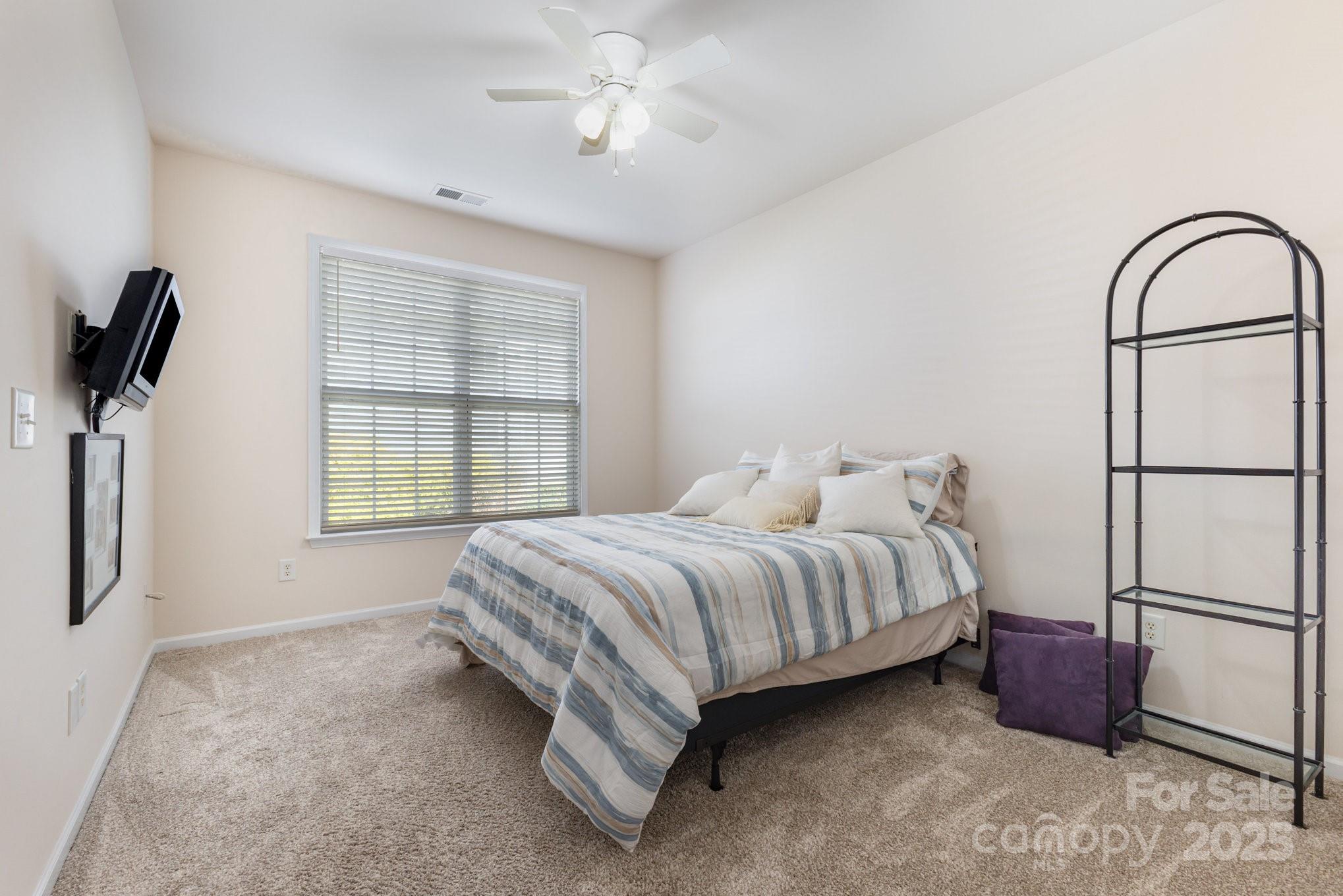 881 Platinum Drive Fort Mill, SC 29708 - Photo 22 of 35 a spacious bedroom with a bed and a window