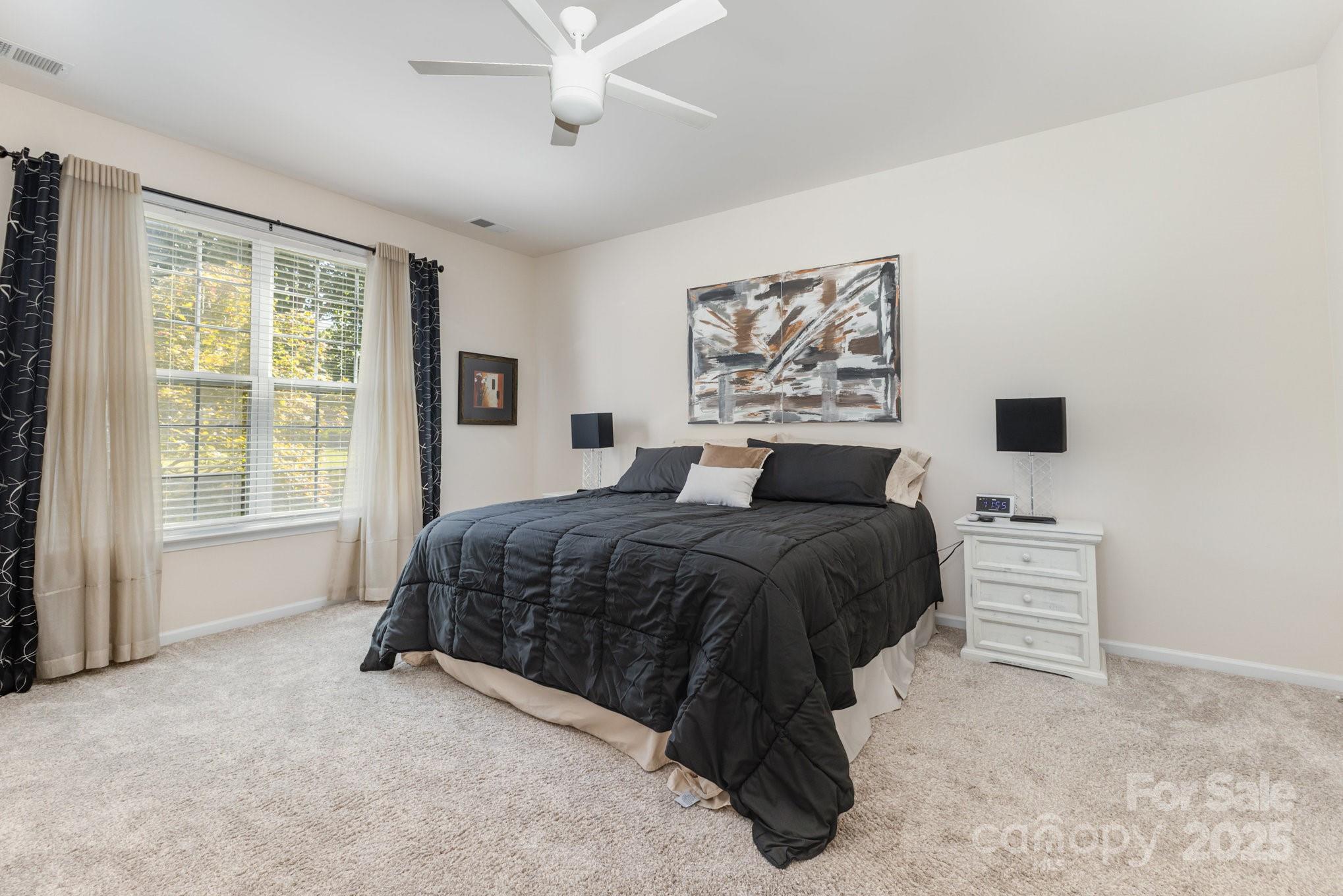 881 Platinum Drive Fort Mill, SC 29708 - Photo 29 of 35 a spacious bedroom with a bed and a window