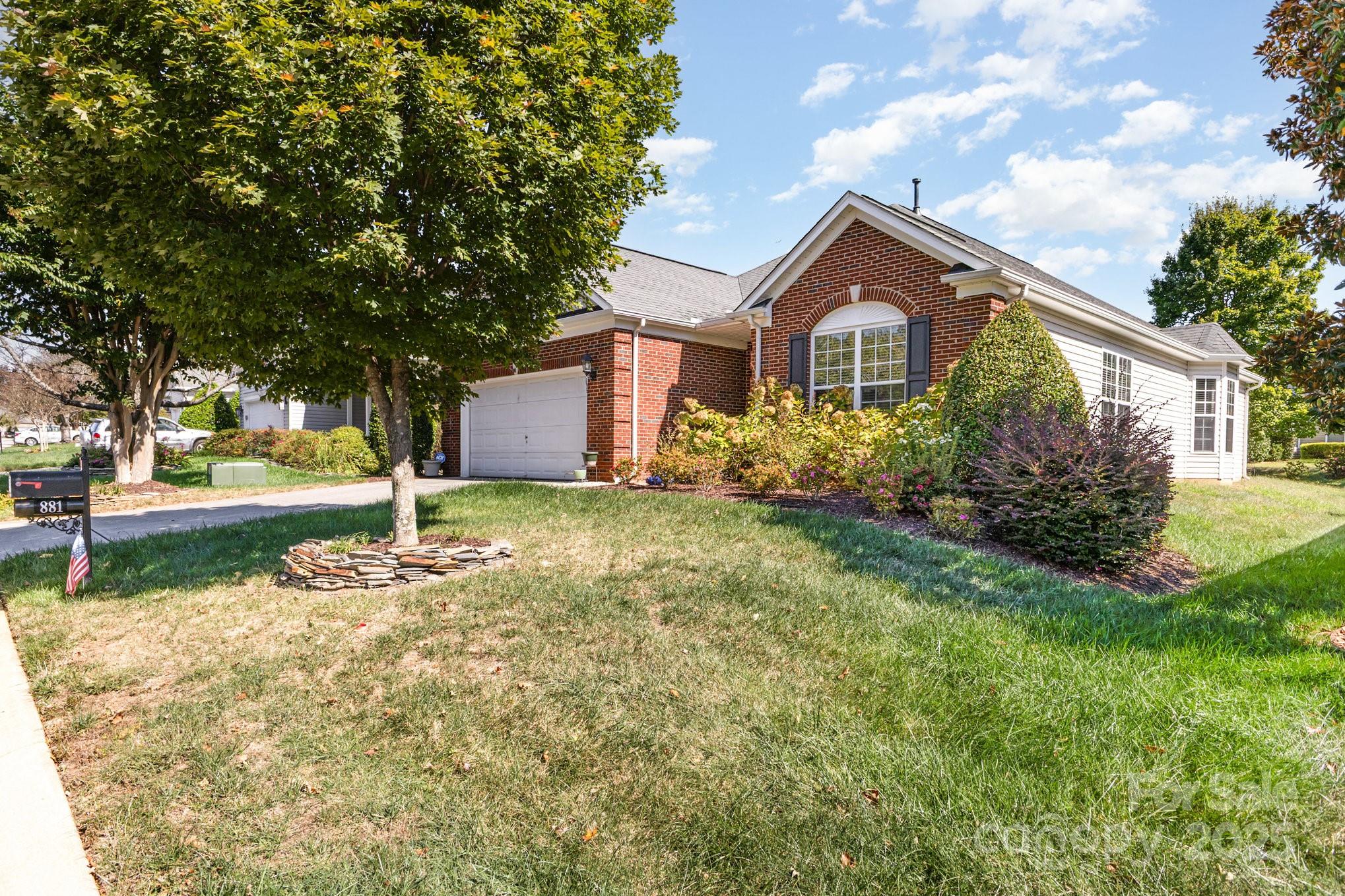 881 Platinum Drive Fort Mill, SC 29708 - Photo 3 of 35 a front view of a house with garden