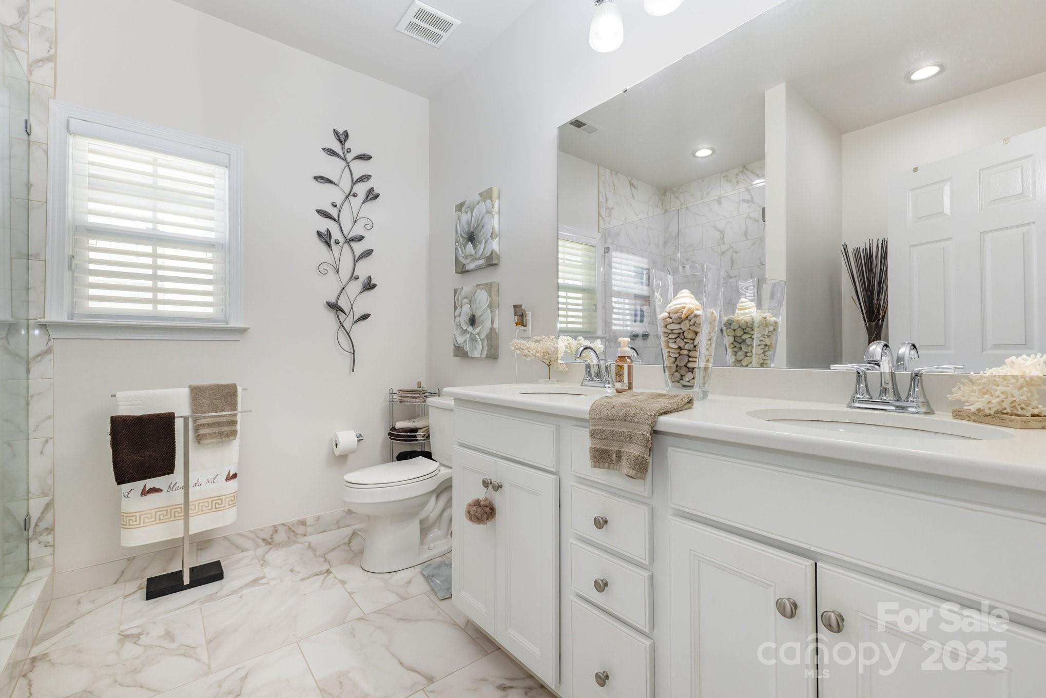 881 Platinum Drive Fort Mill, SC 29708 - Photo 31 of 35 a bathroom with a double vanity sink mirror and toilet