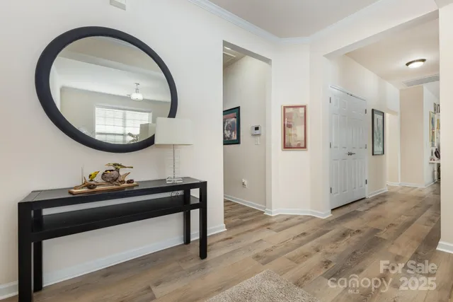 a view of a livingroom with furniture and mirror