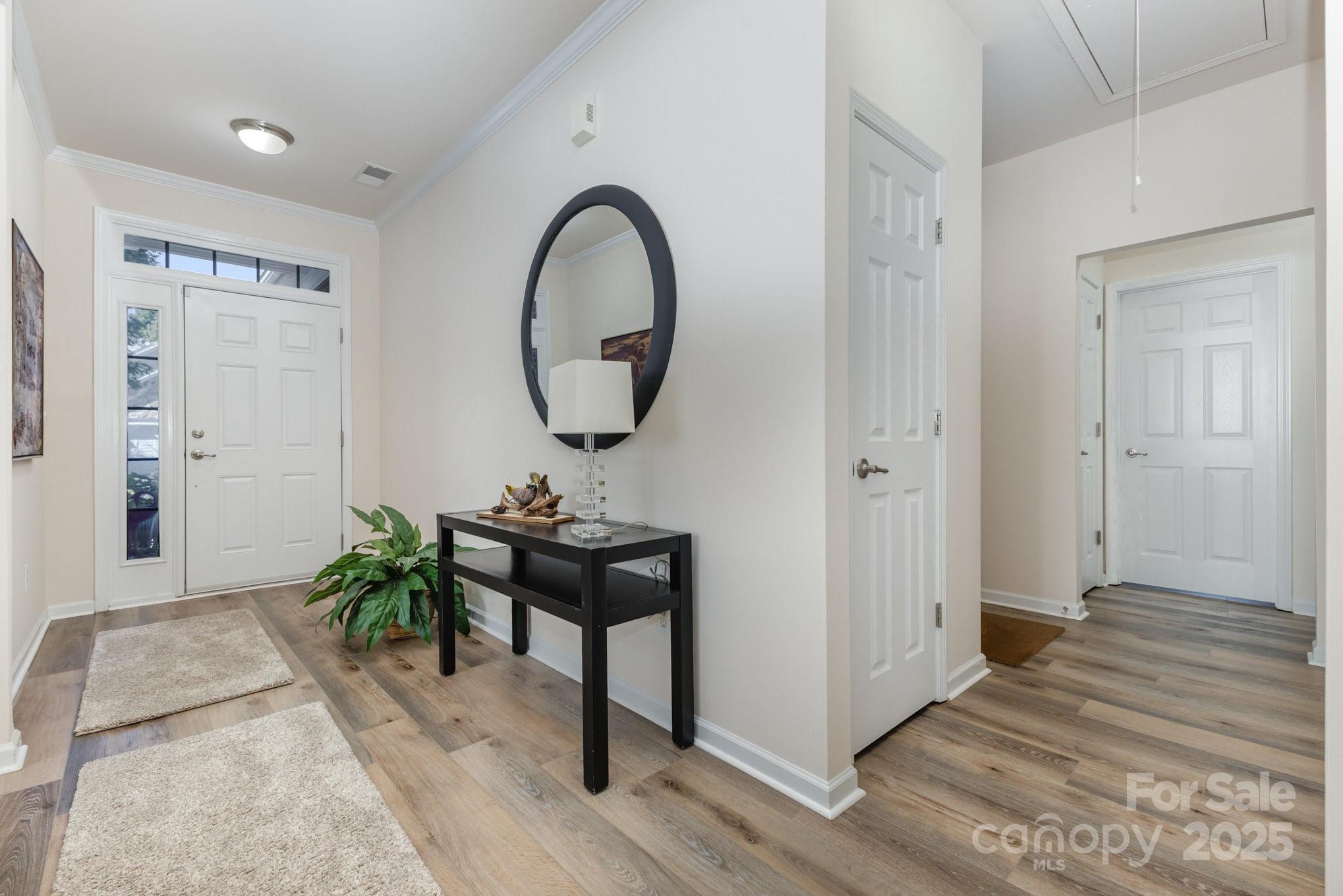 881 Platinum Drive Fort Mill, SC 29708 - Photo 6 of 35 a view of a room that has a bench and a potted plant on table