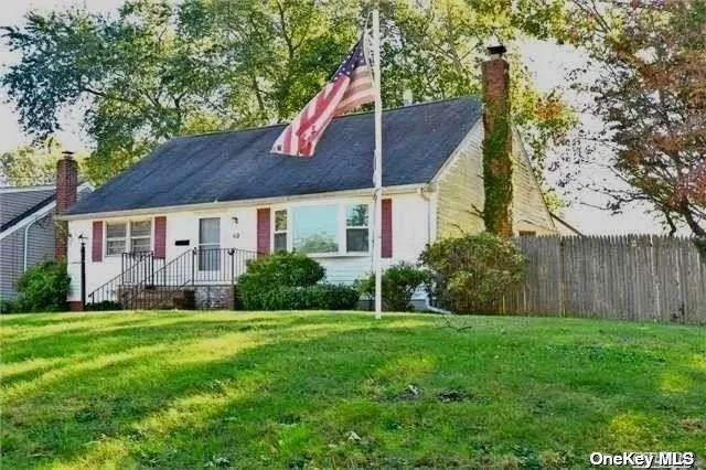 a view of a house next to a yard with plants