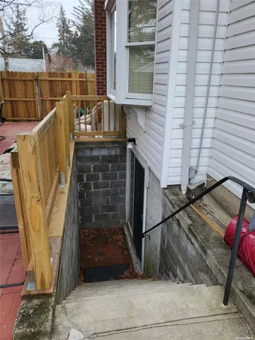 a view of a balcony with wooden floor and outdoor space