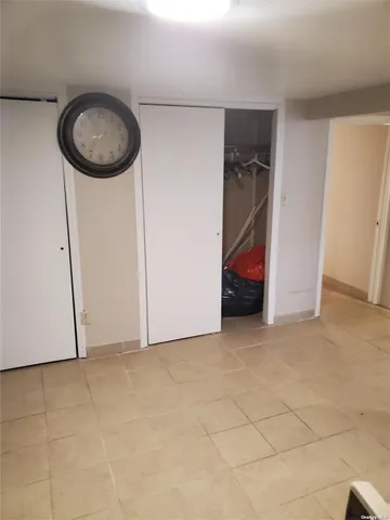 a view of a room with a utility room and stairs