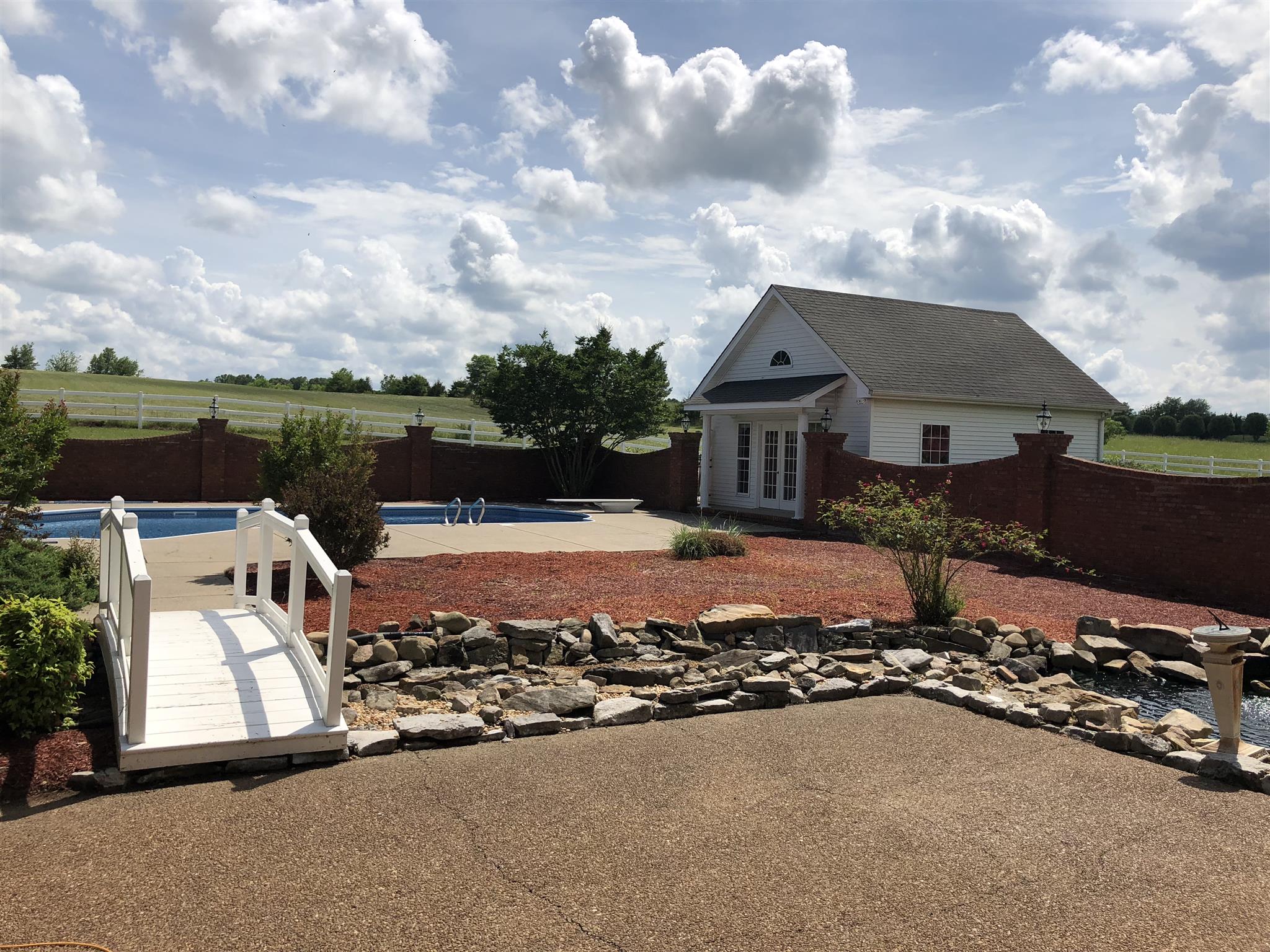 7341 Hall Road Greenbrier, TN 37073 - Photo 9 of 30 Bridge from patio leads to the pool
