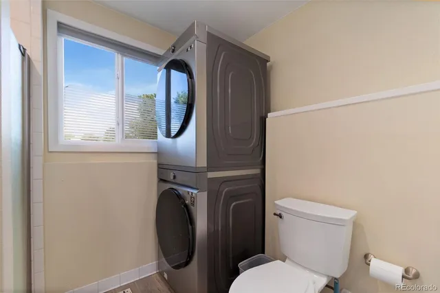 a white toilet sitting next to a bathroom sink