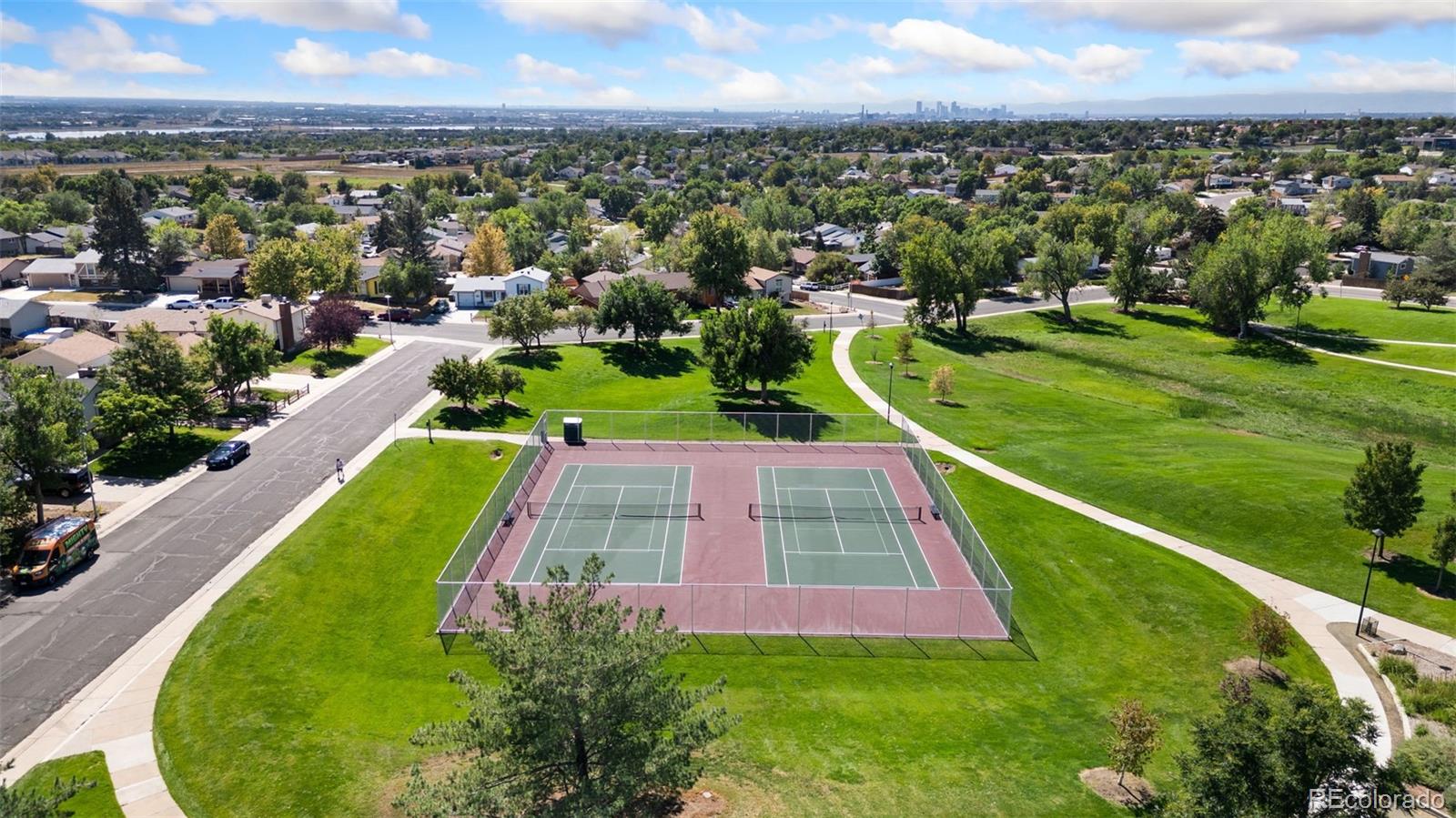 9953 Travis Street Thornton, CO 80229 - Photo 34 of 35 an aerial view of residential houses with outdoor space and swimming pool