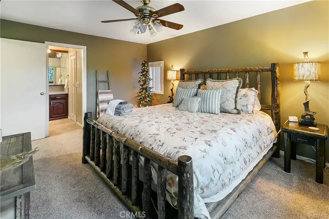 a bedroom with bed and wooden floor