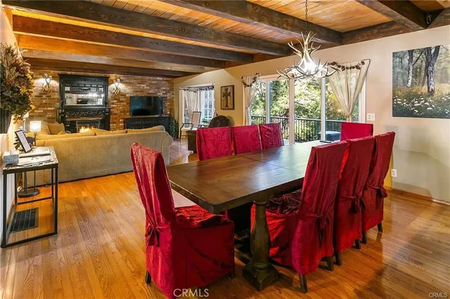 a view of a dining room with furniture and chandelier