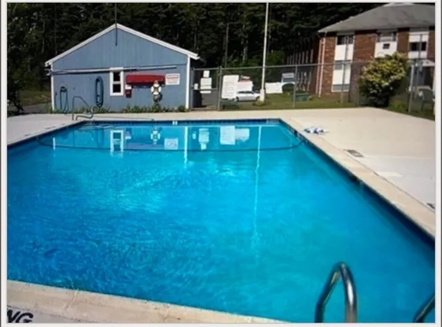 a swimming pool view with a outdoor space