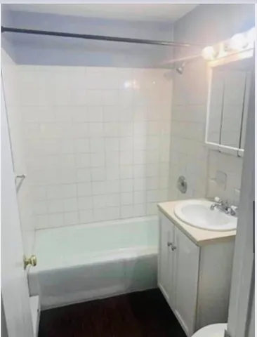 a bathroom with a sink a bathtub and a shower