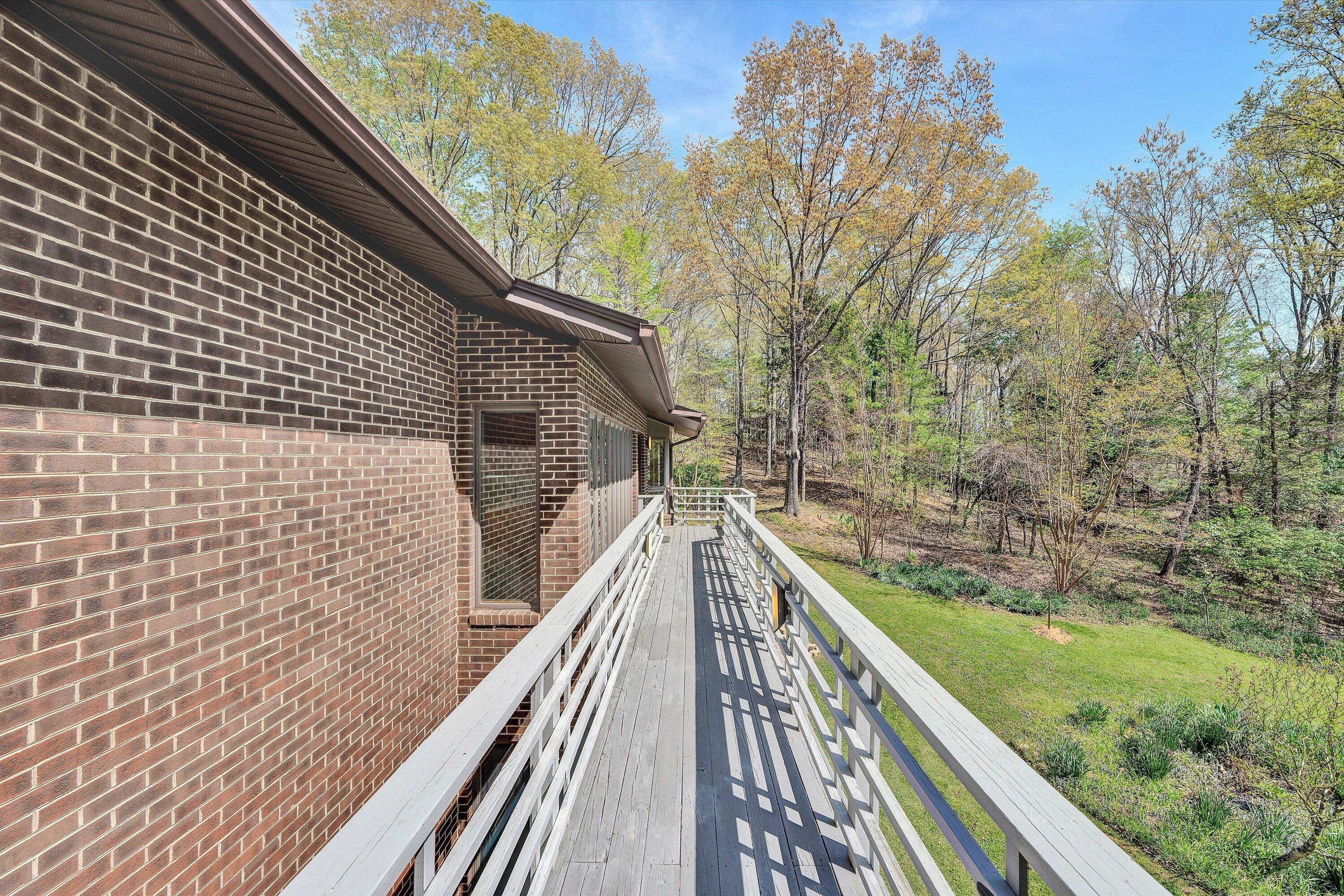 1124 Old Hollow Road Buchanan, VA 24066 - Photo 8 of 73 a view of balcony with wooden floor and fence and floor to ceiling window