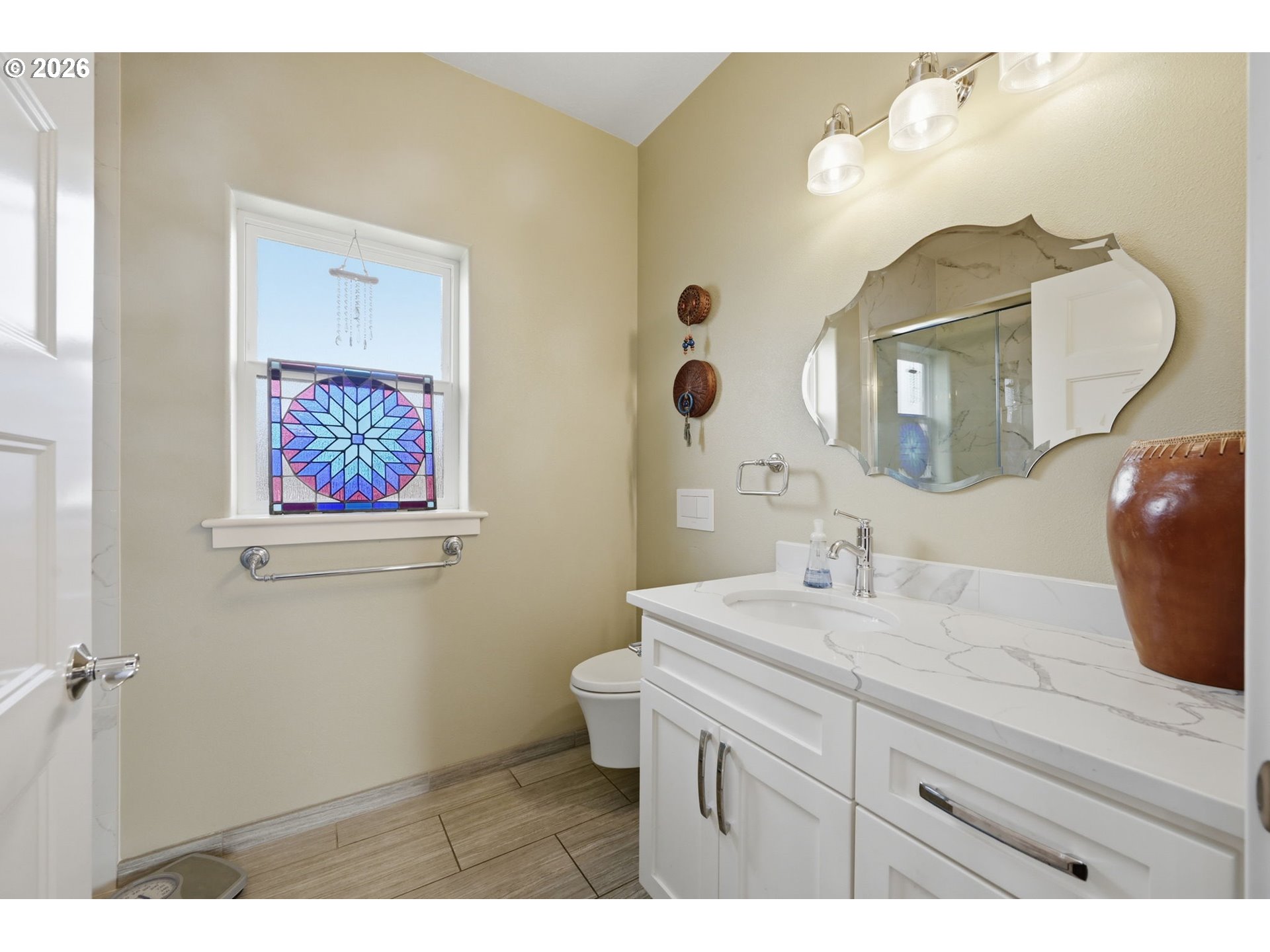 1308 East Main Street Cottage Grove, OR 97424 - Photo 17 of 48 a bathroom with a sink mirror and vanity
