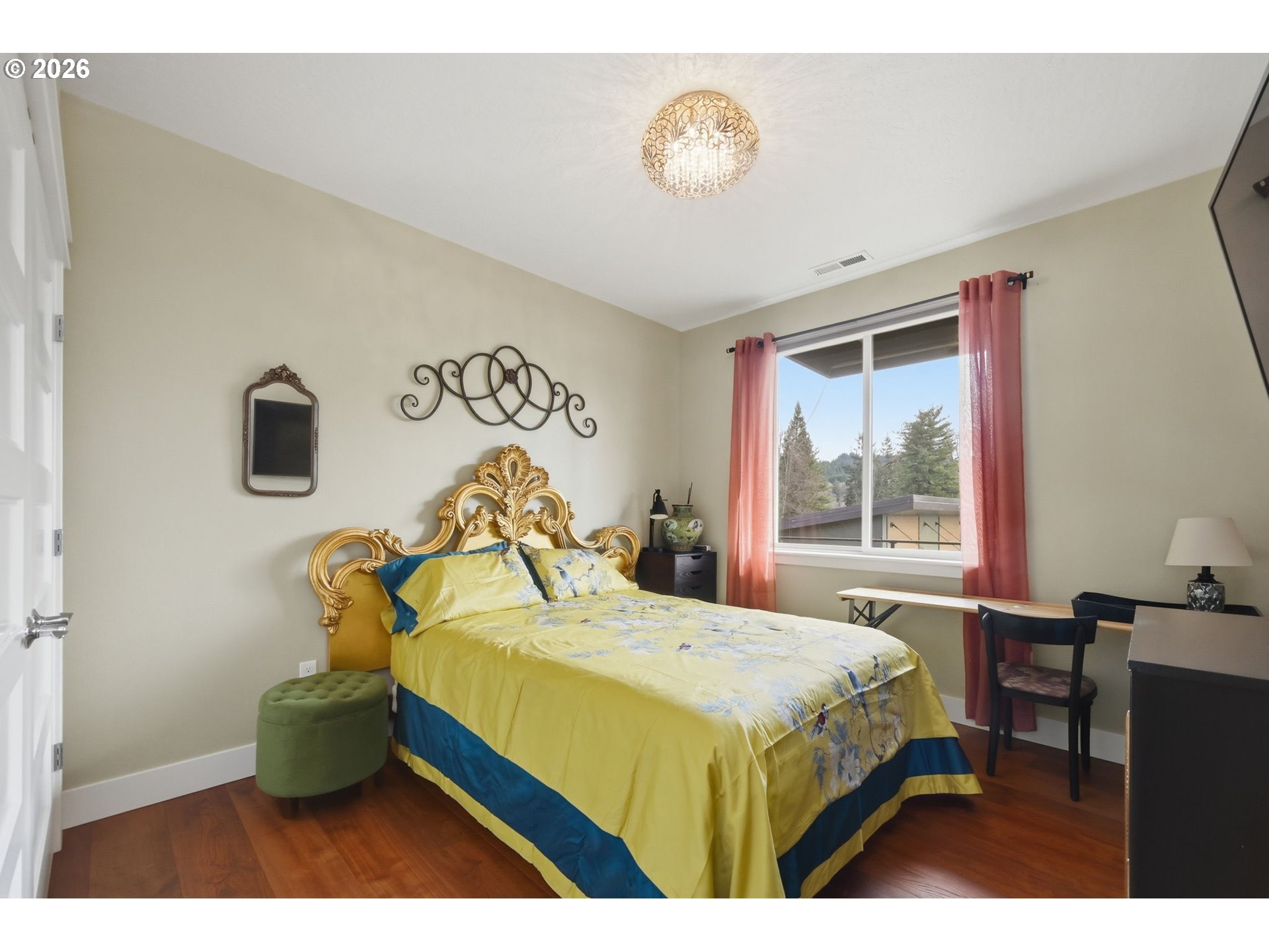 1308 East Main Street Cottage Grove, OR 97424 - Photo 19 of 48 a bedroom with a bed and a table