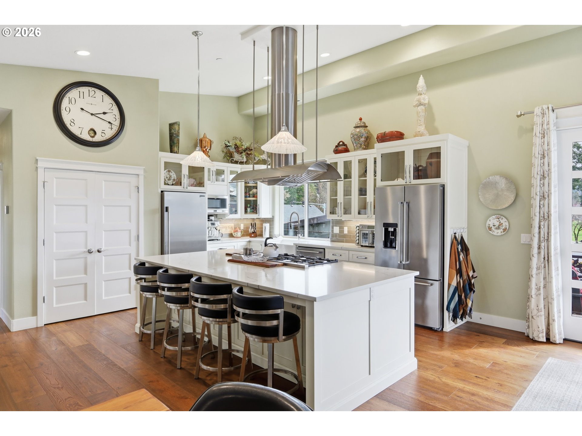 1308 East Main Street Cottage Grove, OR 97424 - Photo 9 of 48 a very nice looking dining room with kitchen island furniture a clock and a view of kitchen