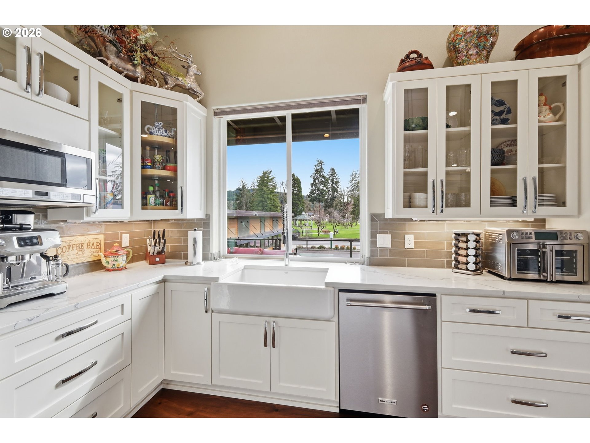 1308 East Main Street Cottage Grove, OR 97424 - Photo 10 of 48 a kitchen with granite countertop a sink window and cabinets