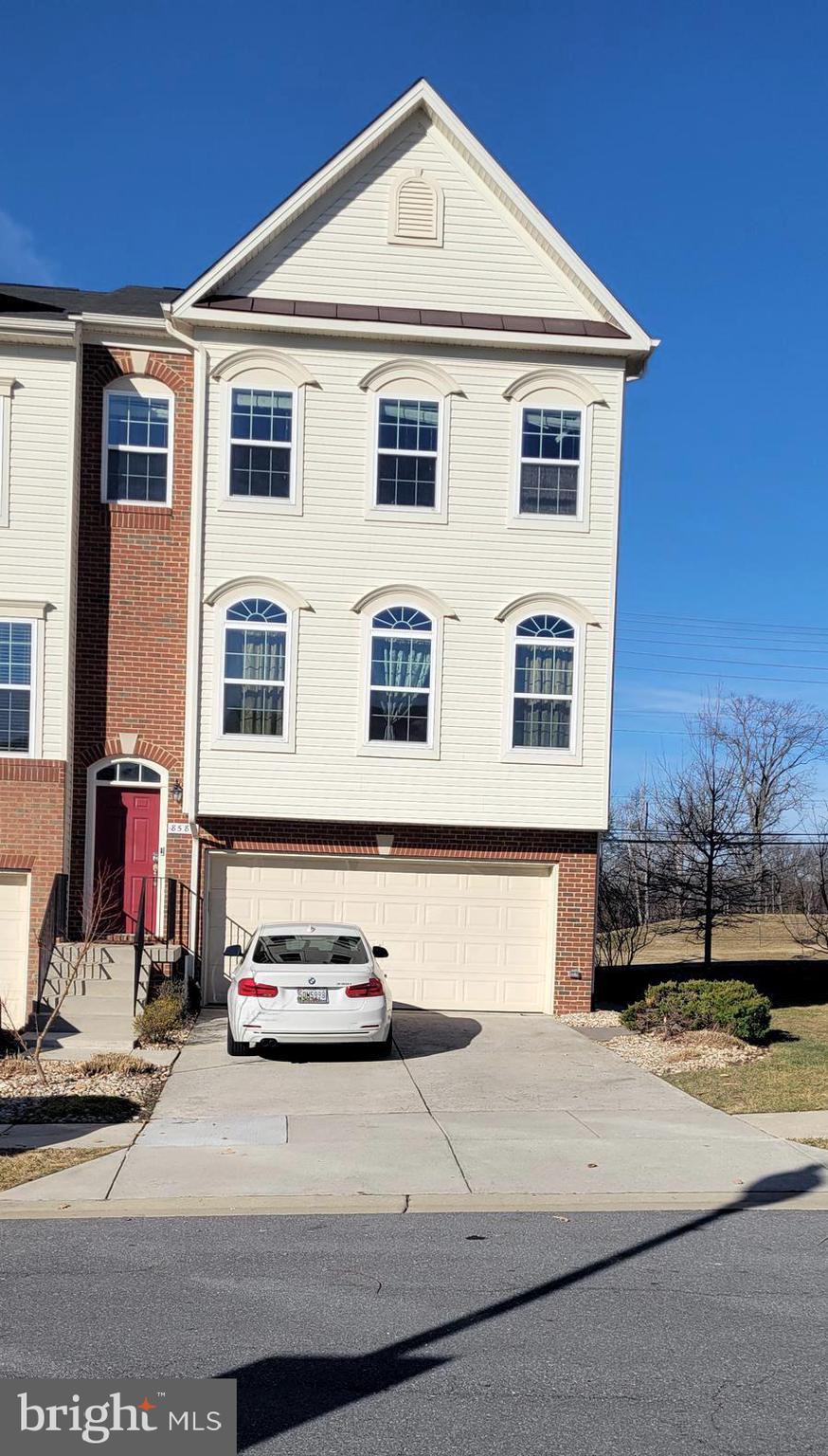 a car parked in front of a house