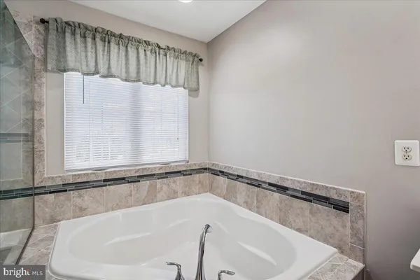 a close view of a bathtub in bathroom