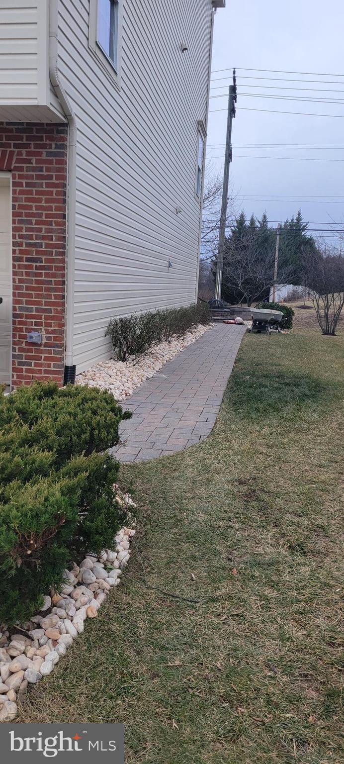 8587 Crooked Tree Lane Laurel, MD 20724 - Photo 26 of 35 Walkway to rear of house