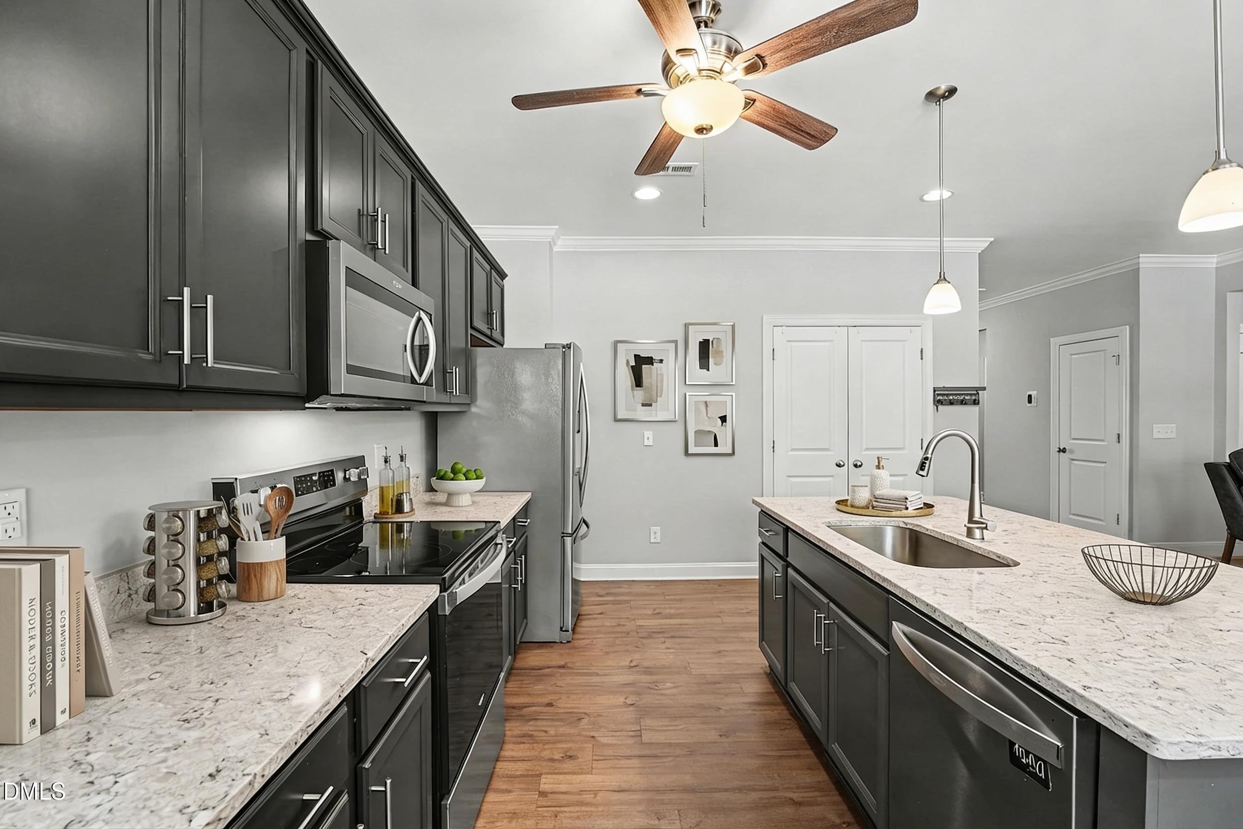130 Aylebury Ridge Zebulon, NC 27597 - Photo 15 of 41 a kitchen with stainless steel appliances granite countertop a sink a stove oven a counter top space and cabinets