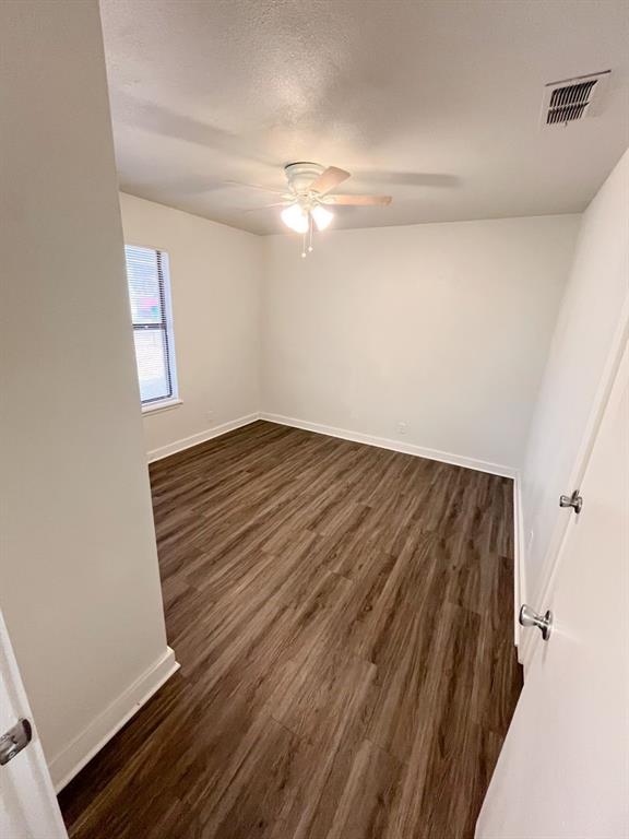 206 East 3rd Street Tolar, TX 76476 - Photo 13 of 21 a view of room with window and ceiling fan