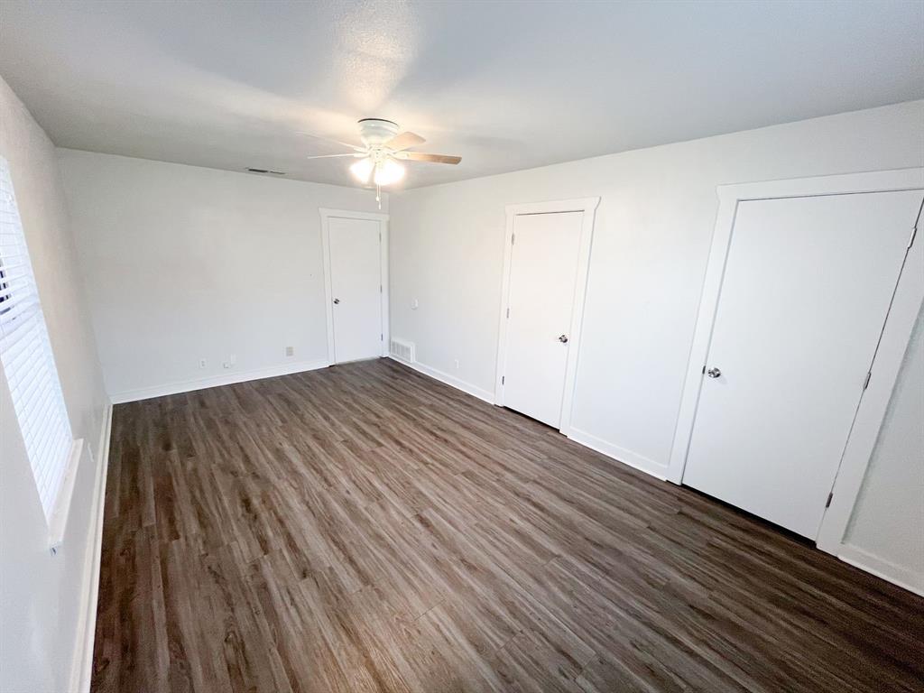 206 East 3rd Street Tolar, TX 76476 - Photo 15 of 21 wooden floor in an empty room