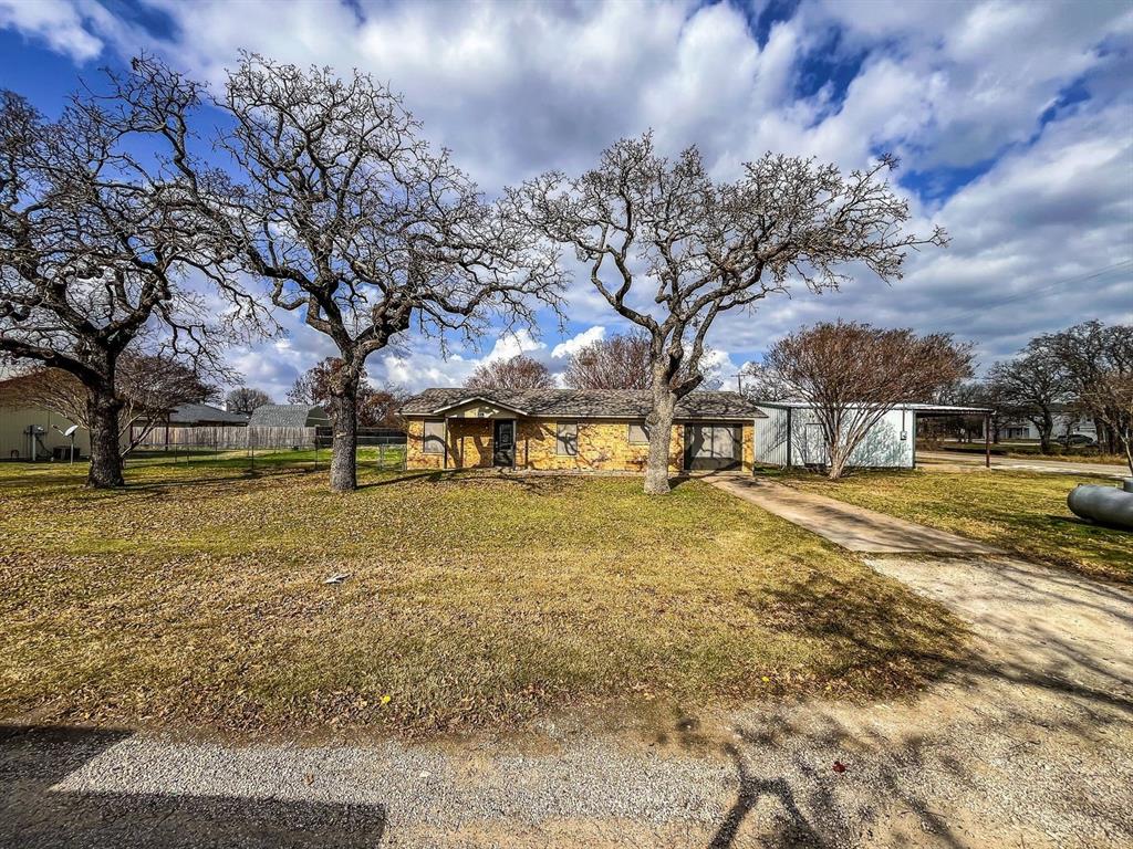 206 East 3rd Street Tolar, TX 76476 - Photo 2 of 21 a view of yard with trees
