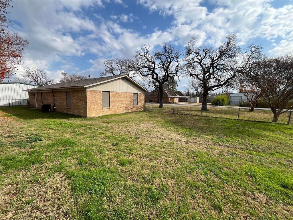 206 East 3rd Street Tolar, TX 76476 - Photo 4 of 21 a view of a house with a yard
