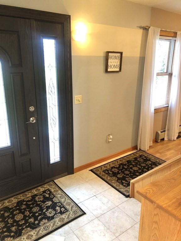 266 River Road Sunderland, MA 01375 - Photo 11 of 38 a view of a livingroom with wooden floor and windows