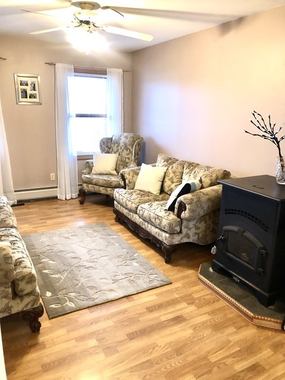 266 River Road Sunderland, MA 01375 - Photo 15 of 38 a living room with furniture window and a flat screen tv
