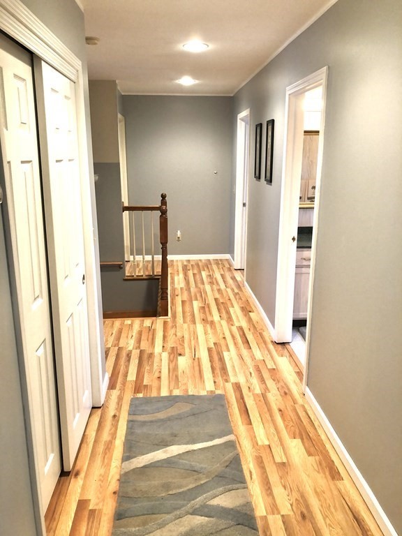 266 River Road Sunderland, MA 01375 - Photo 24 of 38 a bedroom with a bed and wooden floor