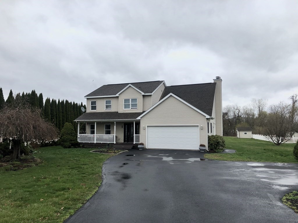 266 River Road Sunderland, MA 01375 - Photo 3 of 38 a view of a white house next to a yard with big trees