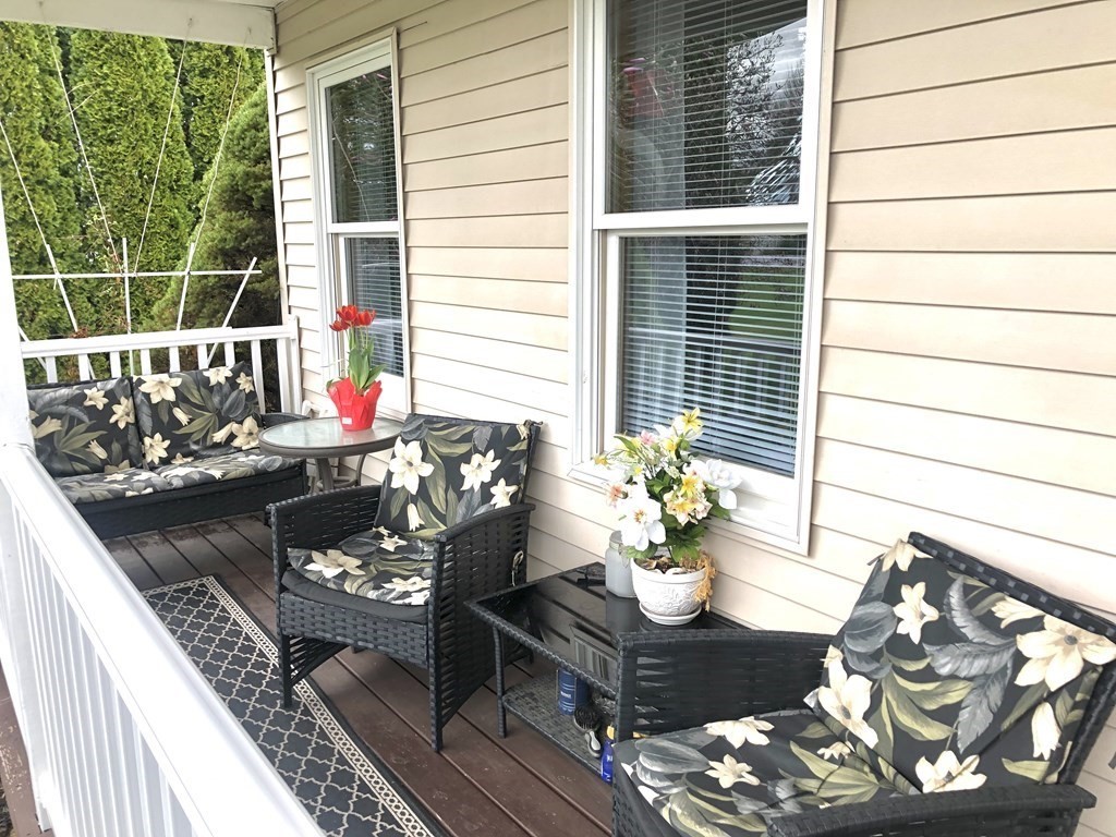 266 River Road Sunderland, MA 01375 - Photo 31 of 38 a view of a balcony with chairs and a potted plant