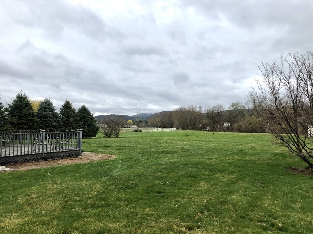 266 River Road Sunderland, MA 01375 - Photo 36 of 38 a view of a green field with wooden fence