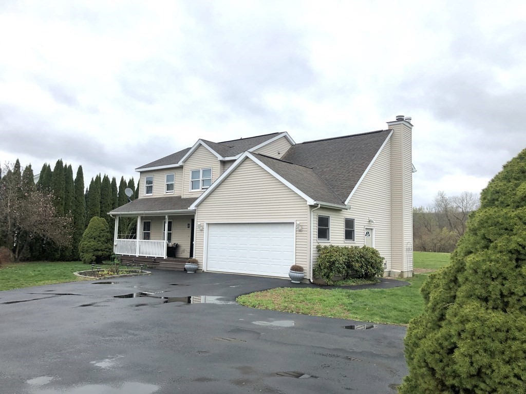 266 River Road Sunderland, MA 01375 - Photo 5 of 38 a view of a house with a yard and plants